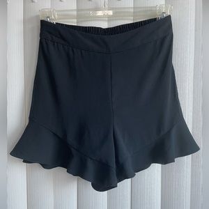 A new day dress shorts in black with scalloped trim. Size small. Like new.